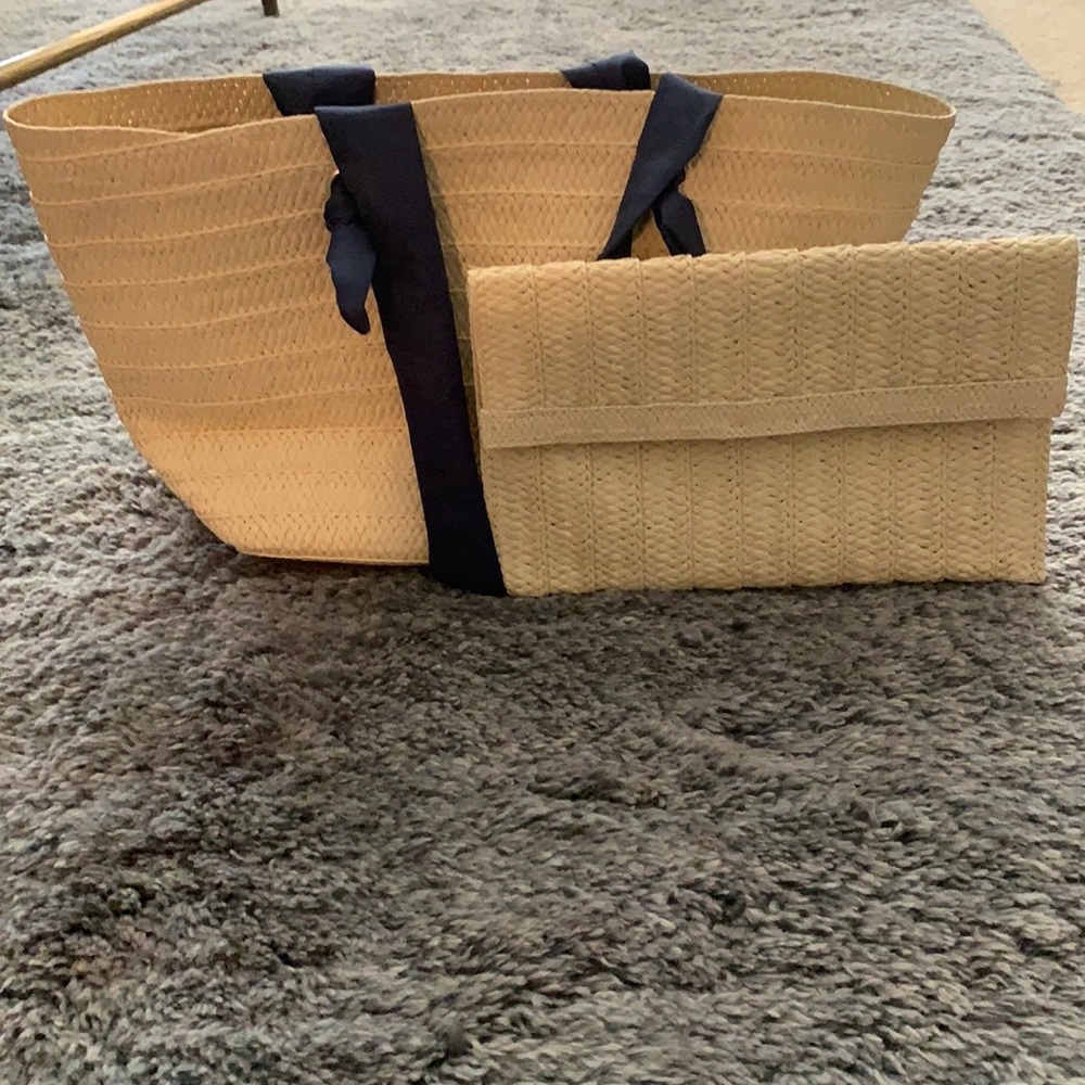 Tote and clutch.  New. Never used.  Blue detailing for handles.